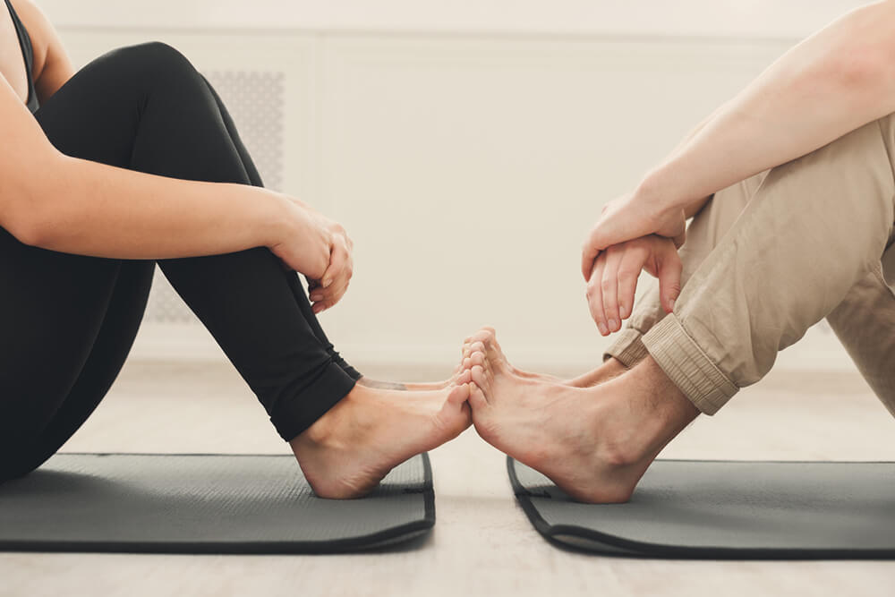 Couple stretching together on a yoga mat hi-res stock photography and  images - Alamy